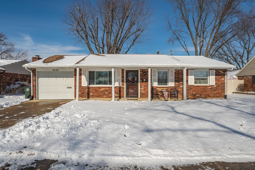 single story home with a garage