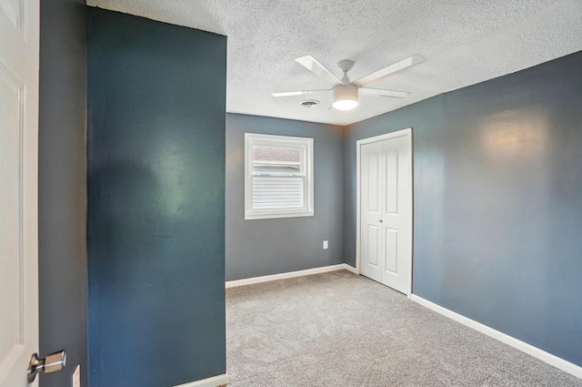 925 E St, Springfield, OH 45505 - carpeted empty room with a textured ceiling, a ceiling fan, and baseboards