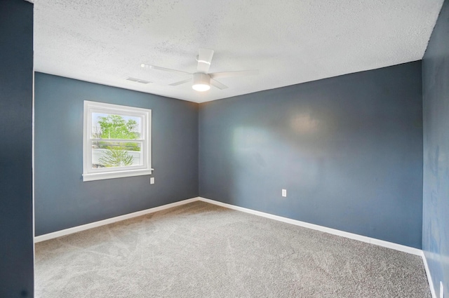 925 E St, Springfield, OH 45505 - unfurnished room featuring a textured ceiling, ceiling fan, carpet floors, and baseboards