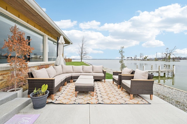 view of patio / terrace with a dock, an outdoor living space, and a water view