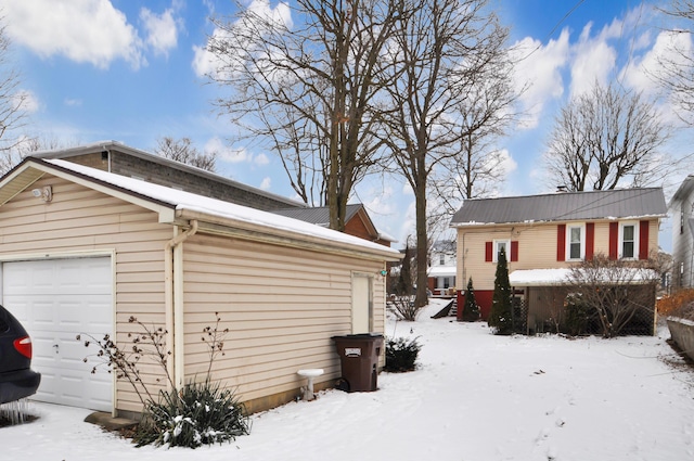 view of snow covered garage