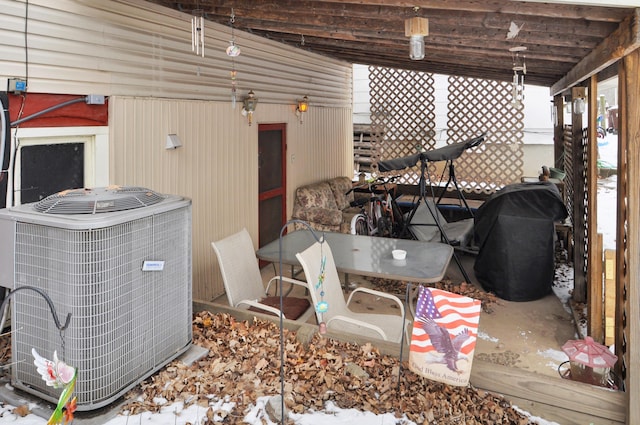 exterior space featuring central AC and area for grilling