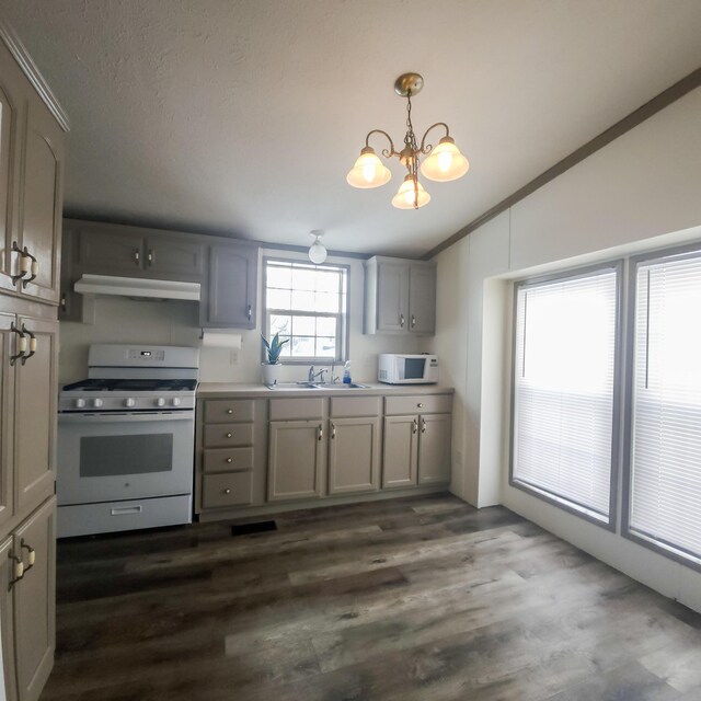 11524 Powhattan Path, Lakeview, OH 43331 - kitchen with white appliances, under cabinet range hood, a sink, gray cabinetry, and a chandelier