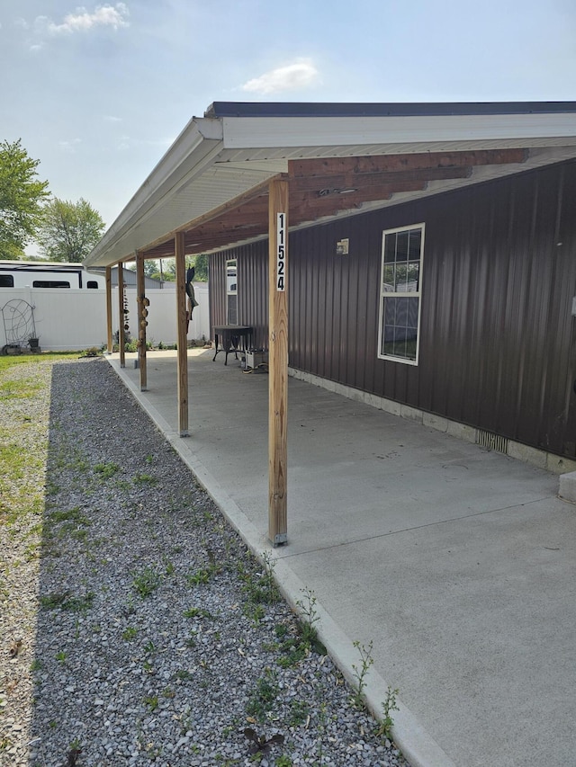 11524 Powhattan Path, Lakeview, OH 43331 - view of patio / terrace featuring an attached carport