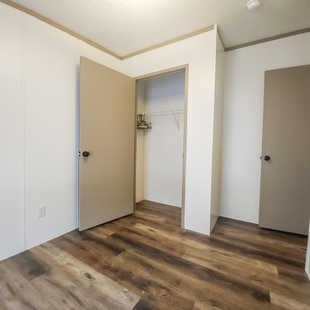 11524 Powhattan Path, Lakeview, OH 43331 - unfurnished bedroom with wood finished floors and a closet