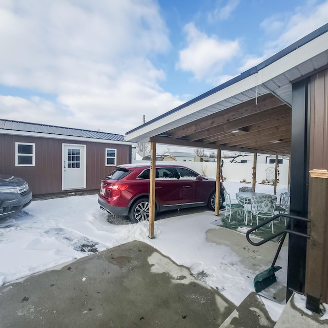 view of snow covered parking