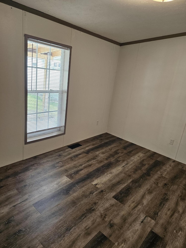 11524 Powhattan Path, Lakeview, OH 43331 - spare room with crown molding and dark wood finished floors