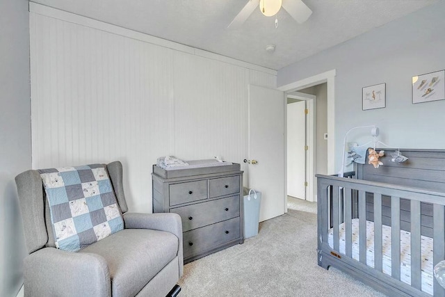 carpeted bedroom with ceiling fan