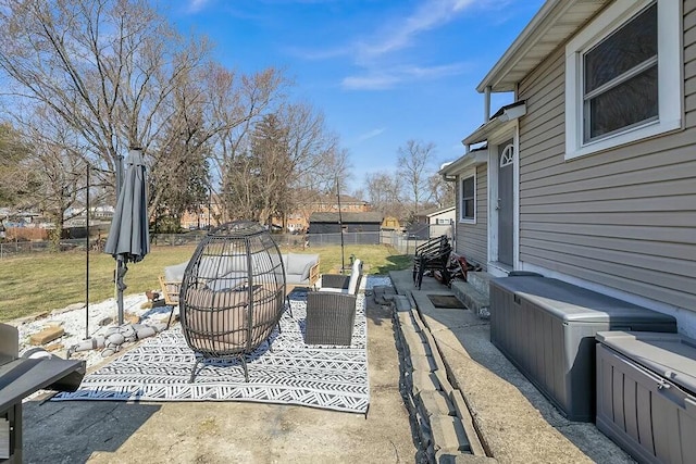 view of patio / terrace with an outdoor living space and fence