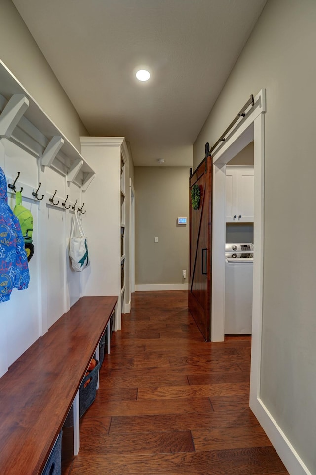 2737 Executive Dr, Troy, OH 45373 - mudroom featuring washer / dryer, a barn door, wood finished floors, and baseboards