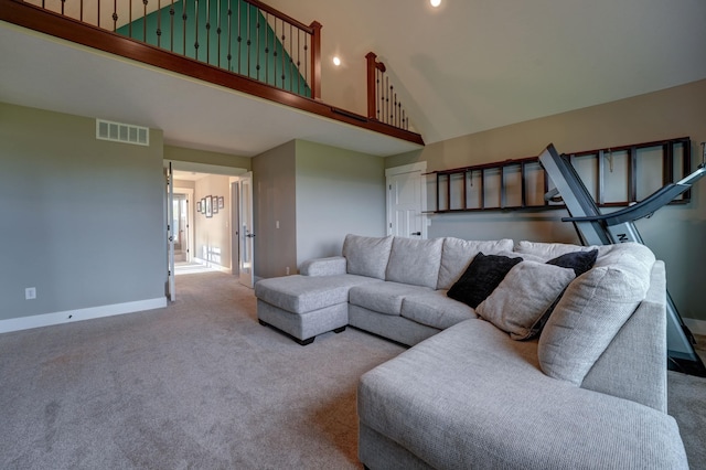 2737 Executive Dr, Troy, OH 45373 - carpeted living room with high vaulted ceiling, baseboards, and recessed lighting