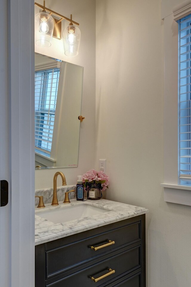 2737 Executive Dr, Troy, OH 45373 - bathroom featuring vanity and healthy amount of natural light