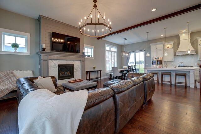 2737 Executive Dr, Troy, OH 45373 - living room featuring dark wood-type flooring, healthy amount of natural light, recessed lighting, and a chandelier
