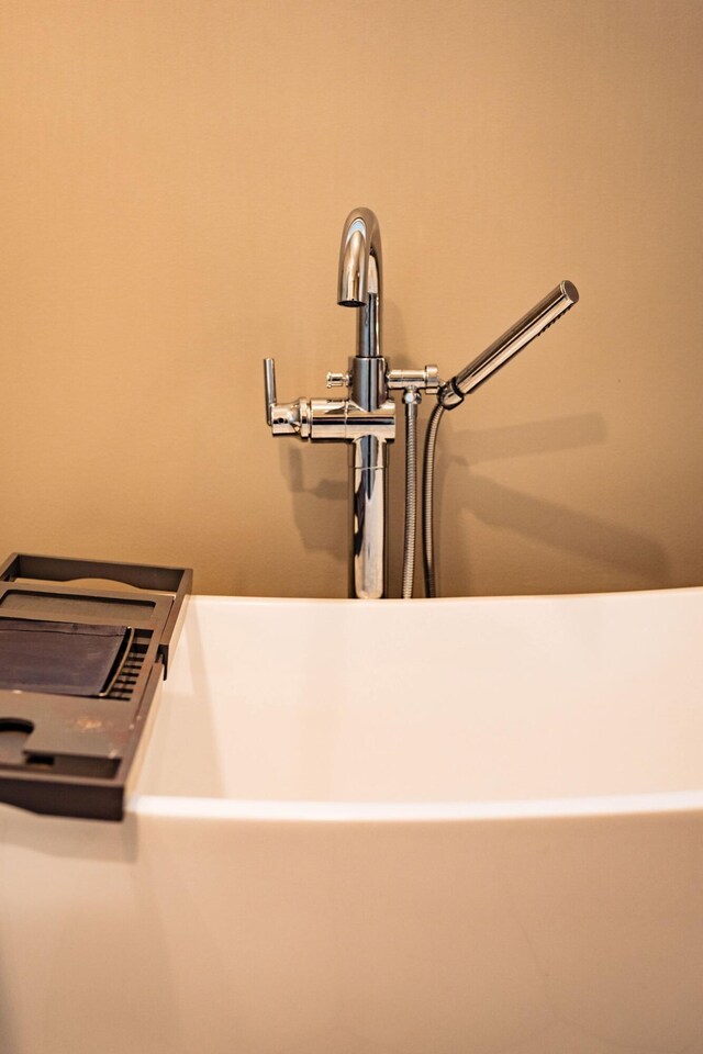 2737 Executive Dr, Troy, OH 45373 - bathroom view of a freestanding tub and a sink