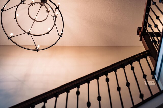 2737 Executive Dr, Troy, OH 45373 - staircase with a chandelier