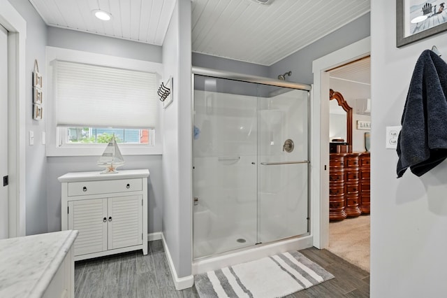14506 Maple Ave, Lakeview, OH 43331 - full bath with wood finished floors, a stall shower, vanity, baseboards, and recessed lighting