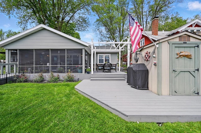 14506 Maple Ave, Lakeview, OH 43331 - rear view of house featuring a sunroom, a deck, a yard, and outdoor dining area