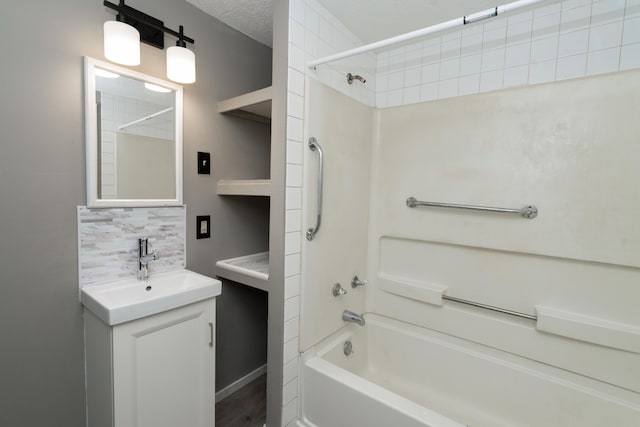 317 S Miami Ave, Xenia, OH 45385 - bathroom with bathtub / shower combination, vanity, and backsplash