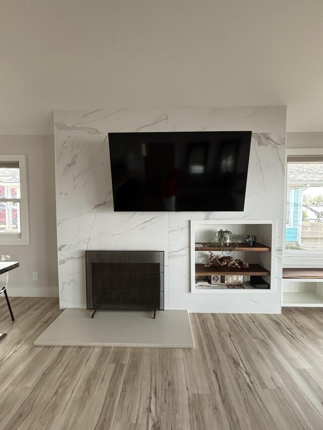 7925 Hickory Ave, Russells Point, OH 43348 - detailed view of wood finished floors, a premium fireplace, and baseboards