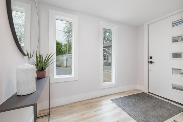 7925 Hickory Ave, Russells Point, OH 43348 - doorway featuring wood finished floors and baseboards