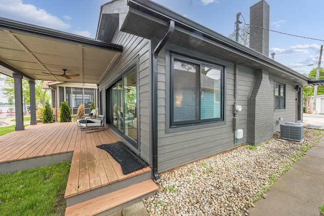 7925 Hickory Ave, Russells Point, OH 43348 - view of property exterior featuring a ceiling fan, a chimney, cooling unit, and a deck