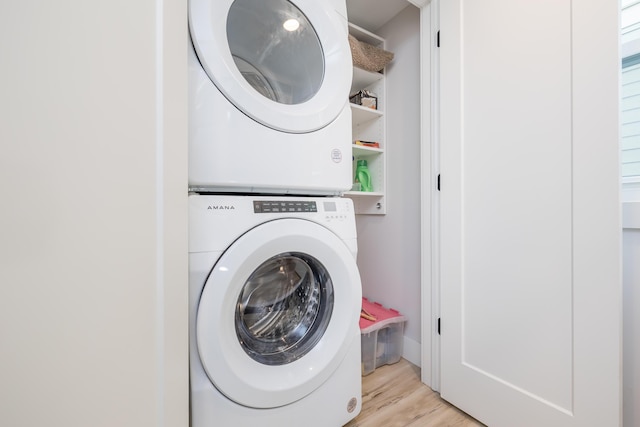 7925 Hickory Ave, Russells Point, OH 43348 - washroom with estacked washer and dryer and light wood finished floors