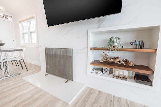 7925 Hickory Ave, Russells Point, OH 43348 - living room with wood finished floors and a fireplace