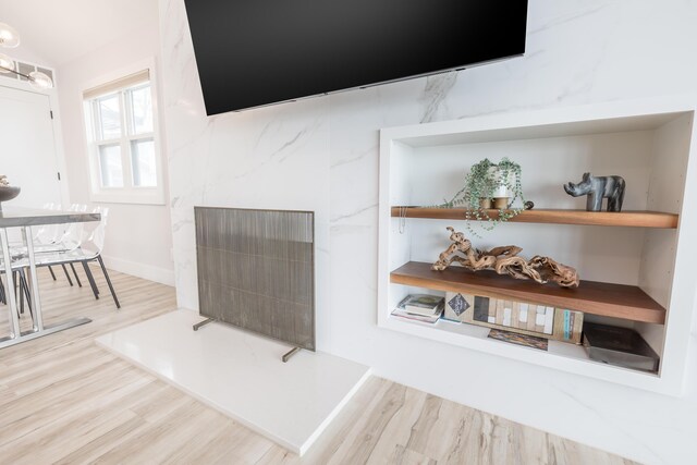 7925 Hickory Ave, Russells Point, OH 43348 - living area with wood finished floors and a high end fireplace