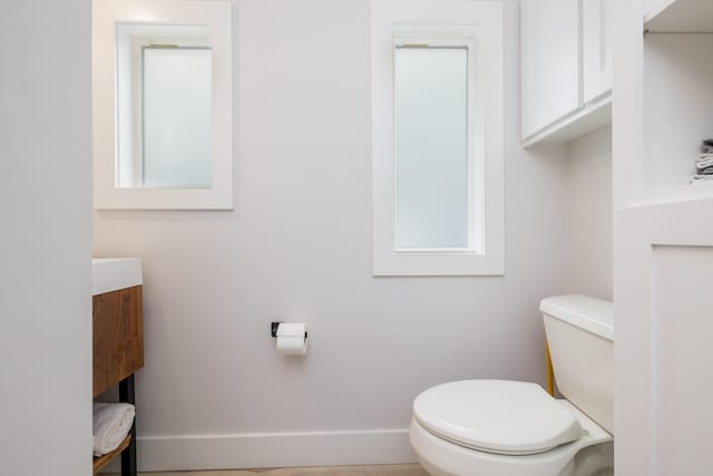 7925 Hickory Ave, Russells Point, OH 43348 - bathroom featuring toilet, vanity, and baseboards