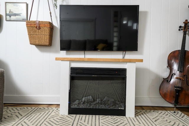 9887 Forest St, Lakeview, OH 43331 - detailed view of wood finished floors, a decorative wall, and baseboards