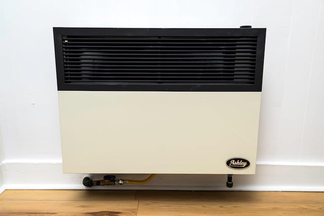 9887 Forest St, Lakeview, OH 43331 - detailed view of heating unit and wood finished floors