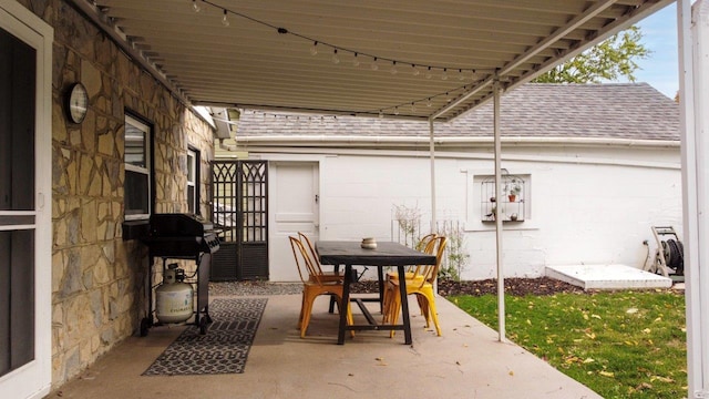 9887 Forest St, Lakeview, OH 43331 - view of patio with a grill and outdoor dining space
