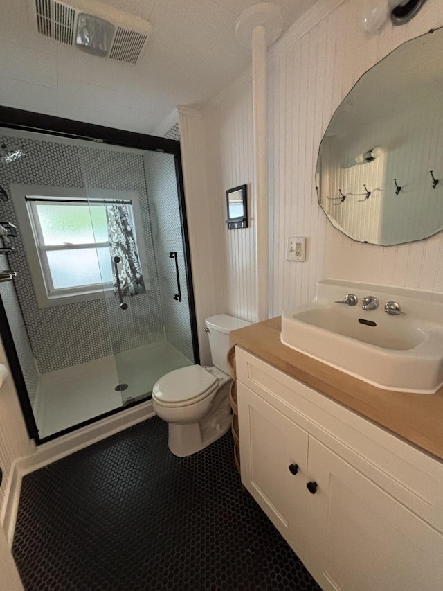 9887 Forest St, Lakeview, OH 43331 - full bathroom with toilet, a stall shower, vanity, and tile patterned floors