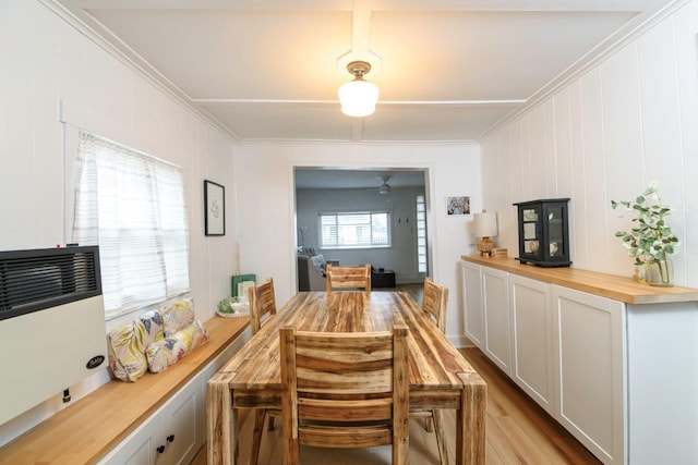 9887 Forest St, Lakeview, OH 43331 - dining space featuring crown molding, light wood-style floors, and ceiling fan
