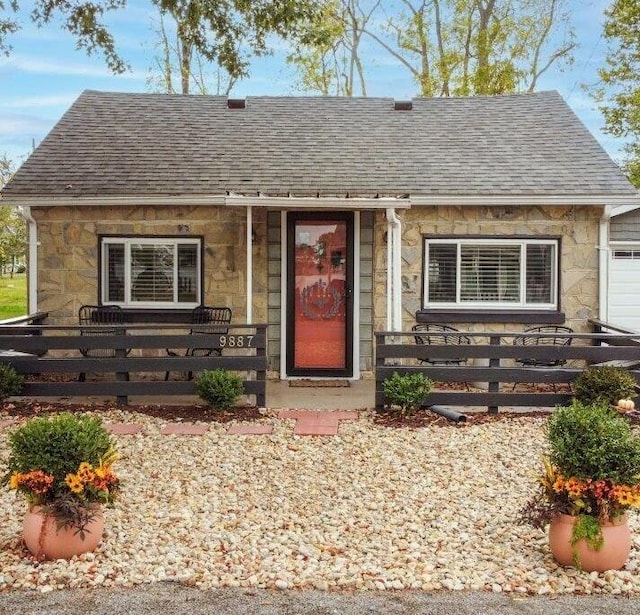 9887 Forest St, Lakeview, OH 43331 - view of front of home featuring stone siding and a shingled roof