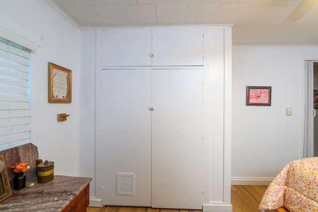 9887 Forest St, Lakeview, OH 43331 - bedroom with a closet, light wood-style floors, and baseboards