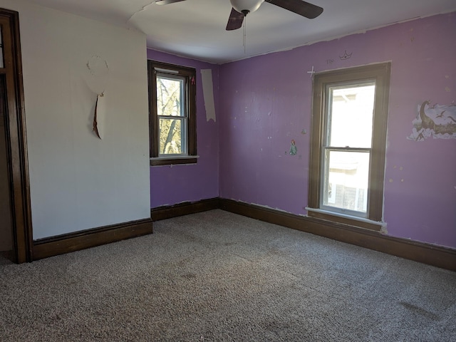 unfurnished room with carpet floors and ceiling fan