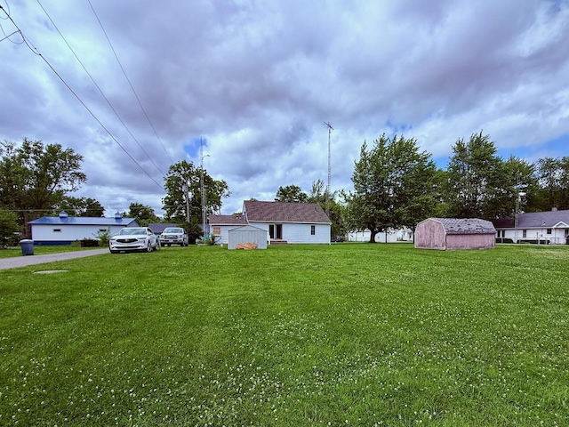 7188 Clark Dr, Russells Point, OH 43348 - view of grassy yard featuring a storage shed