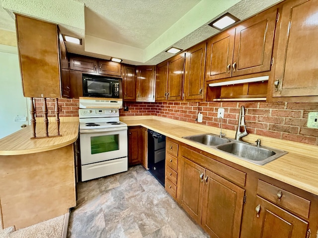 7188 Clark Dr, Russells Point, OH 43348 - kitchen with black appliances, a textured ceiling, light countertops, decorative backsplash, and brown cabinetry