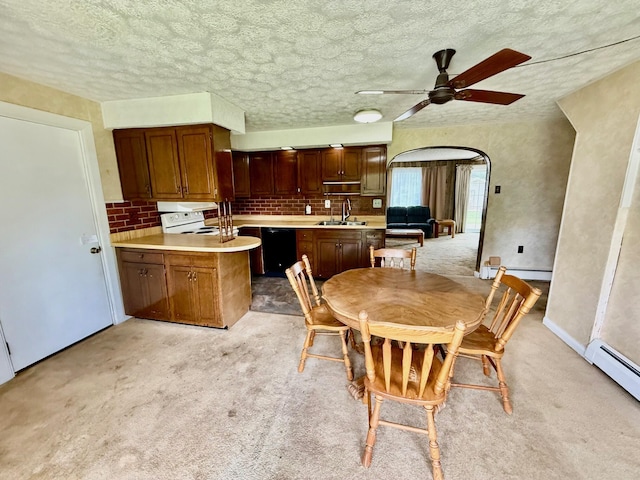 7188 Clark Dr, Russells Point, OH 43348 - dining room with baseboard heating, ceiling fan, light carpet, and a textured ceiling