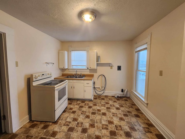 127 N Sycamore St, Union City, OH 45390 - kitchen featuring white electric range oven, a sink, baseboards, white cabinets, and a textured ceiling
