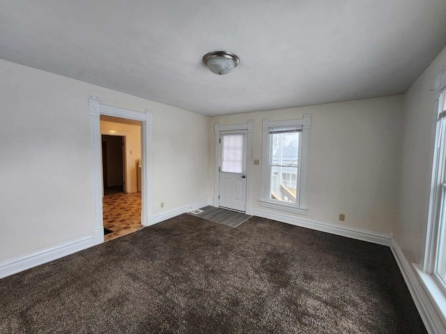 127 N Sycamore St, Union City, OH 45390 - spare room with dark carpet and baseboards