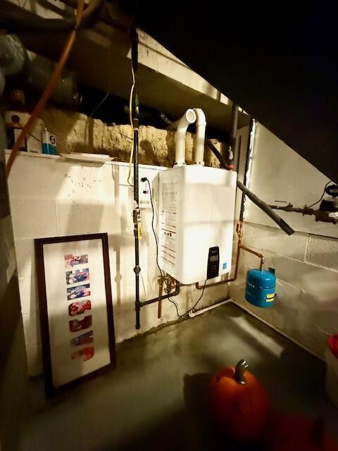 271 N Ludlow St, Covington, OH 45318 - utility room with water heater