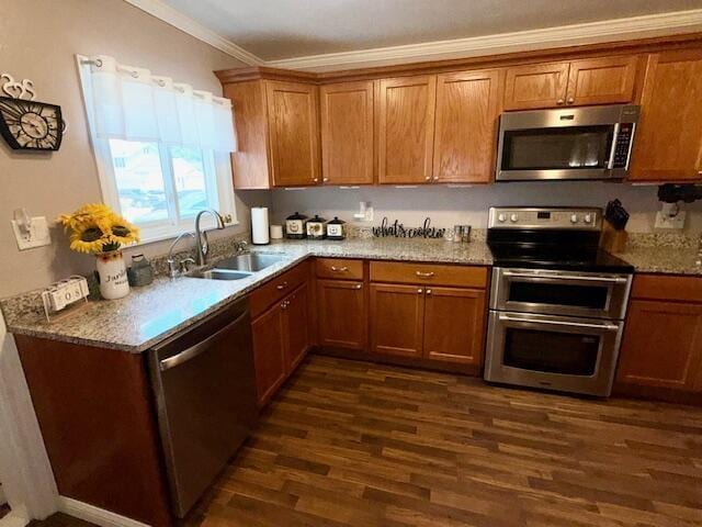 271 N Ludlow St, Covington, OH 45318 - kitchen featuring appliances with stainless steel finishes, dark wood-style flooring, brown cabinetry, and ornamental molding