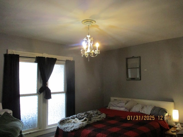 bedroom featuring an inviting chandelier