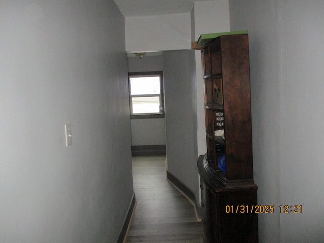 hallway featuring wood-type flooring