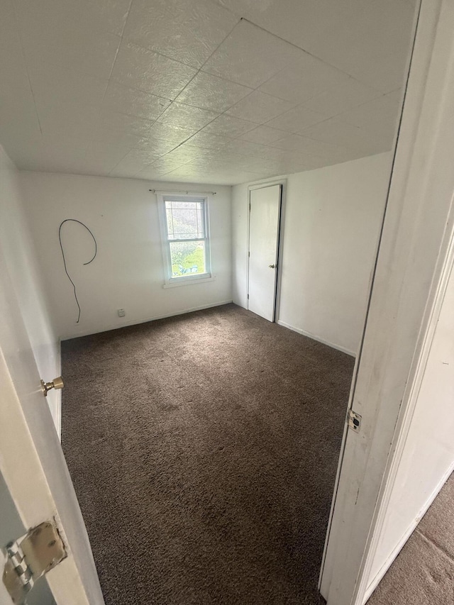 115 Vine St, Ludlow Falls, OH 45339 - unfurnished bedroom featuring carpet flooring
