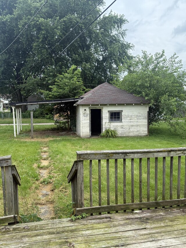 115 Vine St, Ludlow Falls, OH 45339 - view of grassy yard featuring a deck and a shed