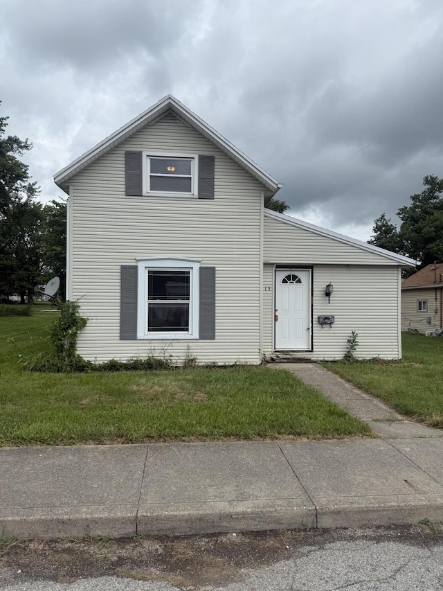 115 Vine St, Ludlow Falls, OH 45339 - traditional home featuring a front lawn