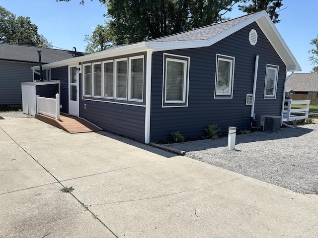 7824 Maple St, Russells Point, OH 43348 - view of front of house with a patio area and a shingled roof